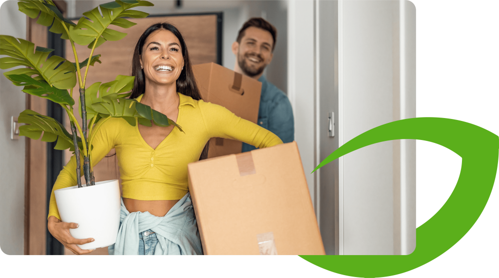 Couple moving house with a handful of boxes. The Appleton Mortgages leaf overlaps the image